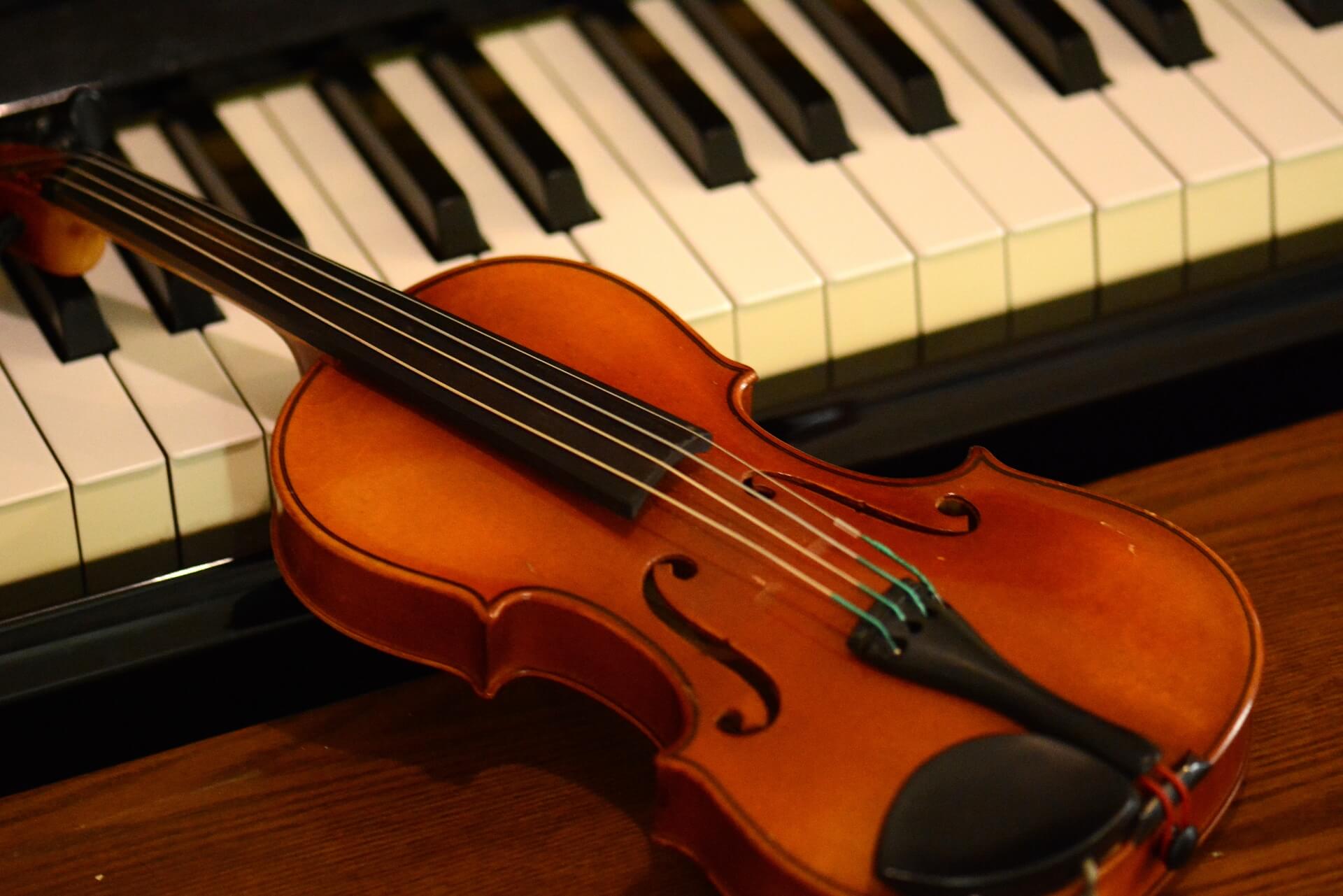 A violin and piano used in the school's music program
